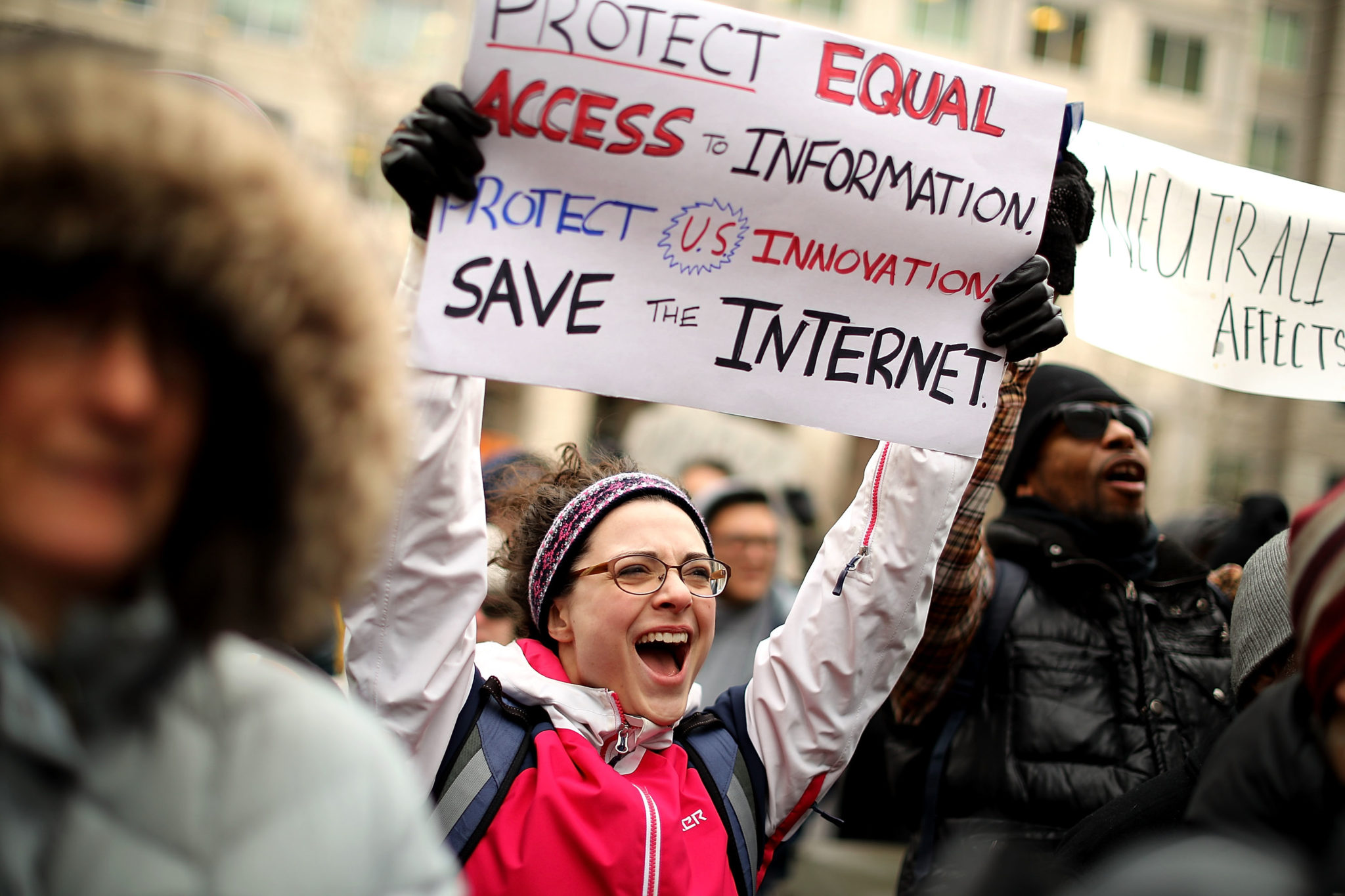 Net Neutrality marcher with sign: Save the internet