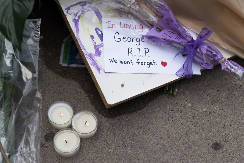 Flowers at George Floyd memorial - photo by Lorie Shaull via flickr