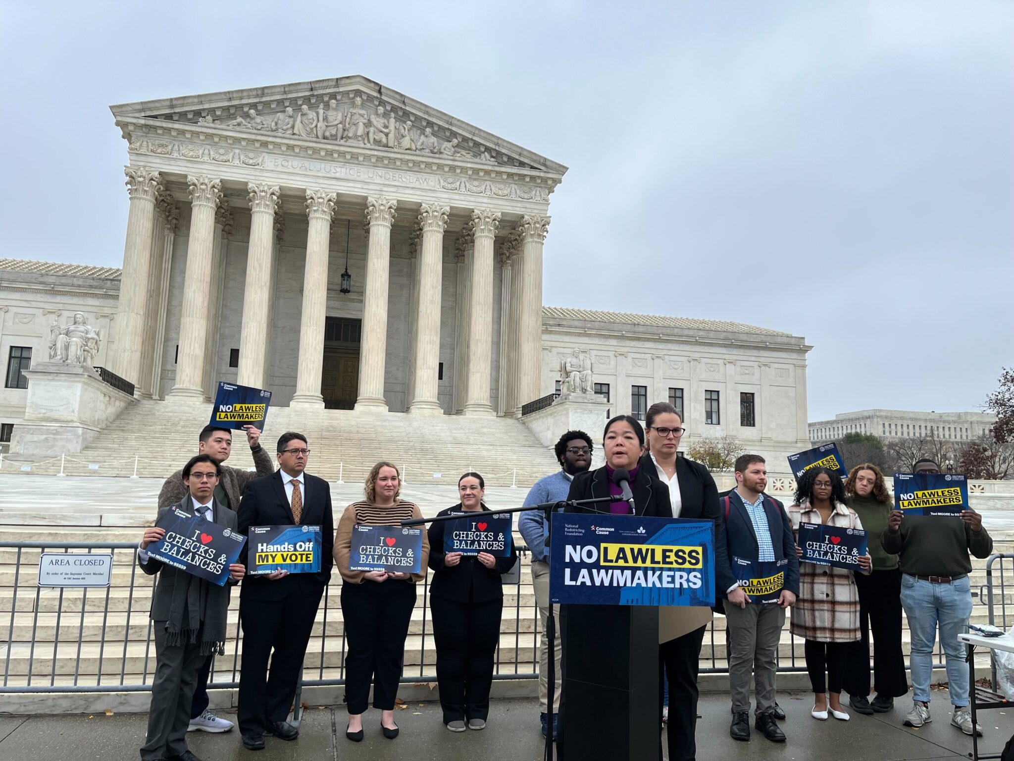 Image of Common Cause and Southern Coalition of Social Justice standing outside the Supreme Court.