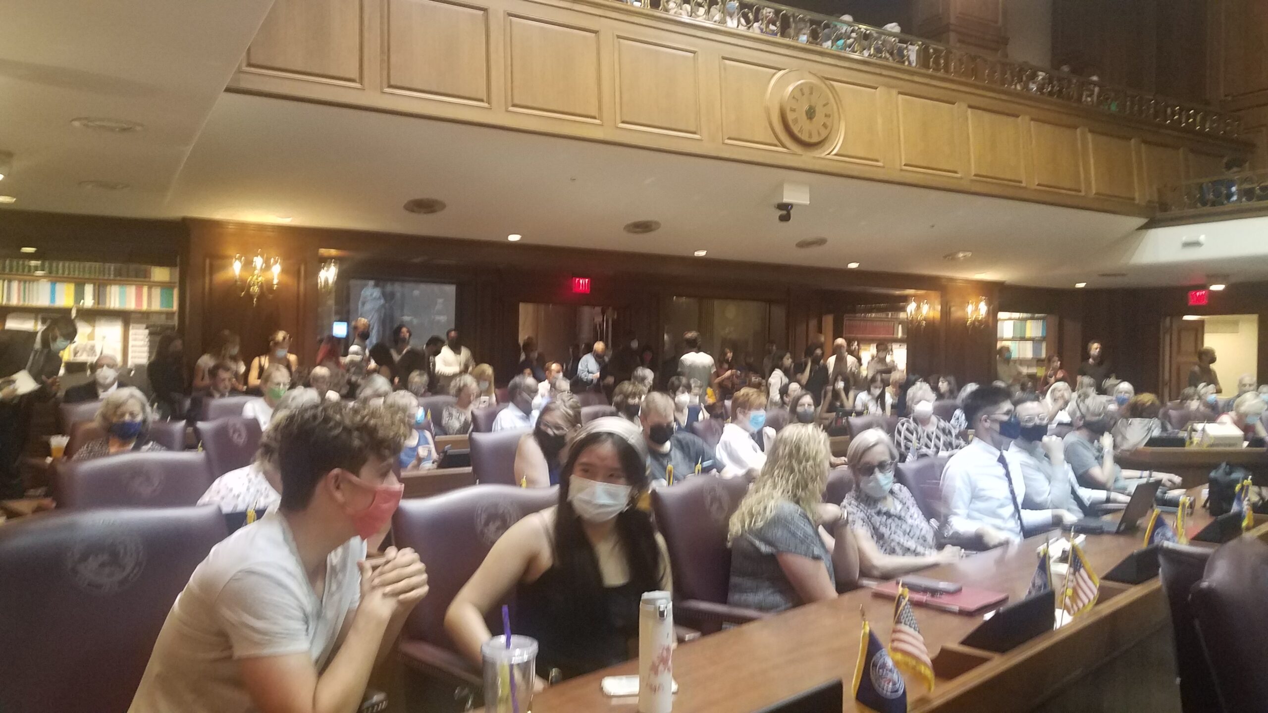 people at a legislative hearing inside the House chamber