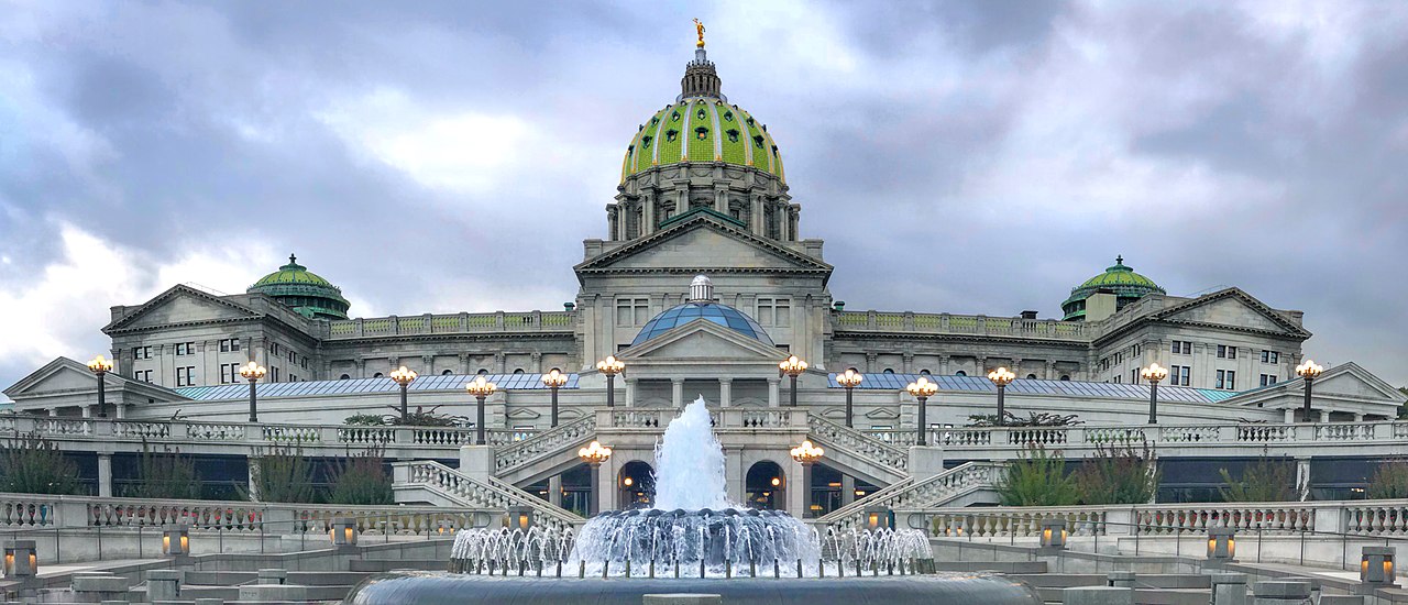 The Pennsylvania Capitol building with the Pennsylvania War Veterans' Memorial Fountain in the foreground.