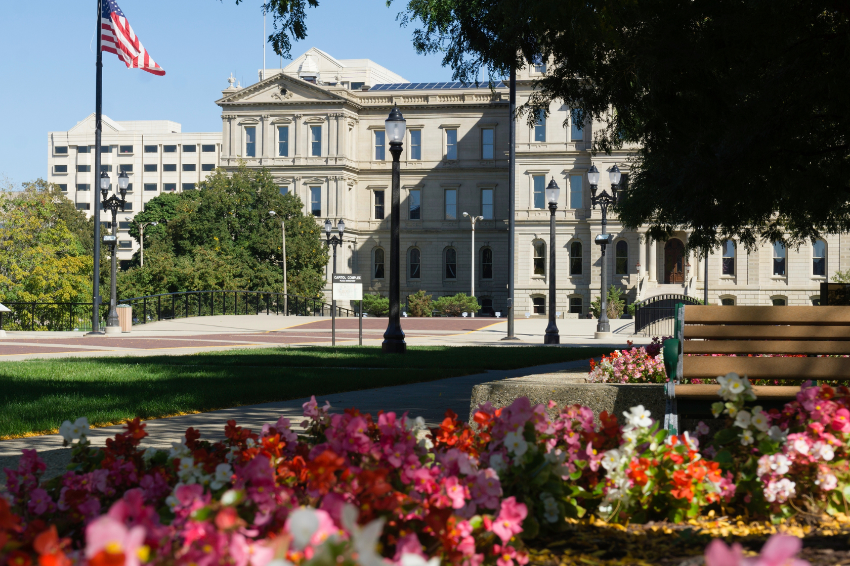 flowers from the capitol lawn with the Michigan State Capitol building in the background.